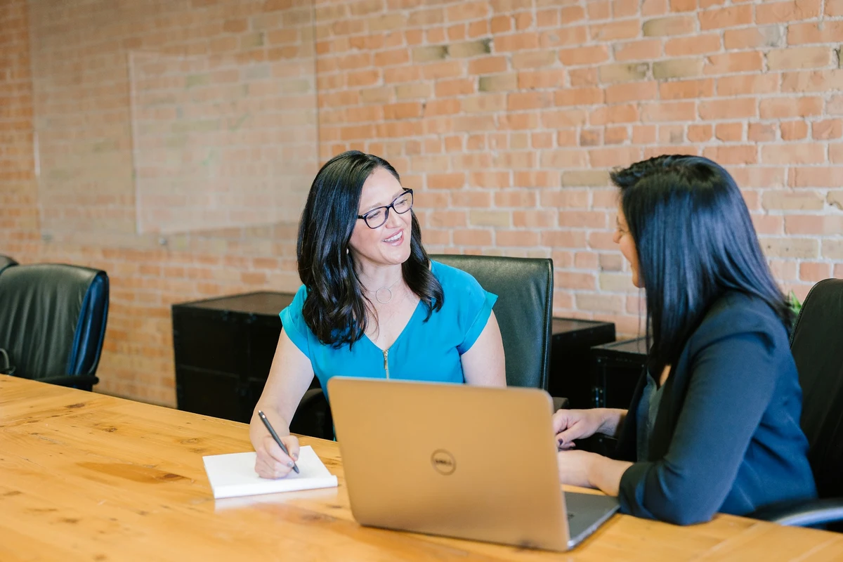 Two women engaged in a professional discussion