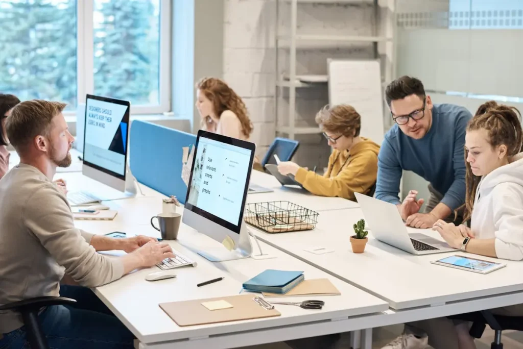 HR team working on computers in an office setting