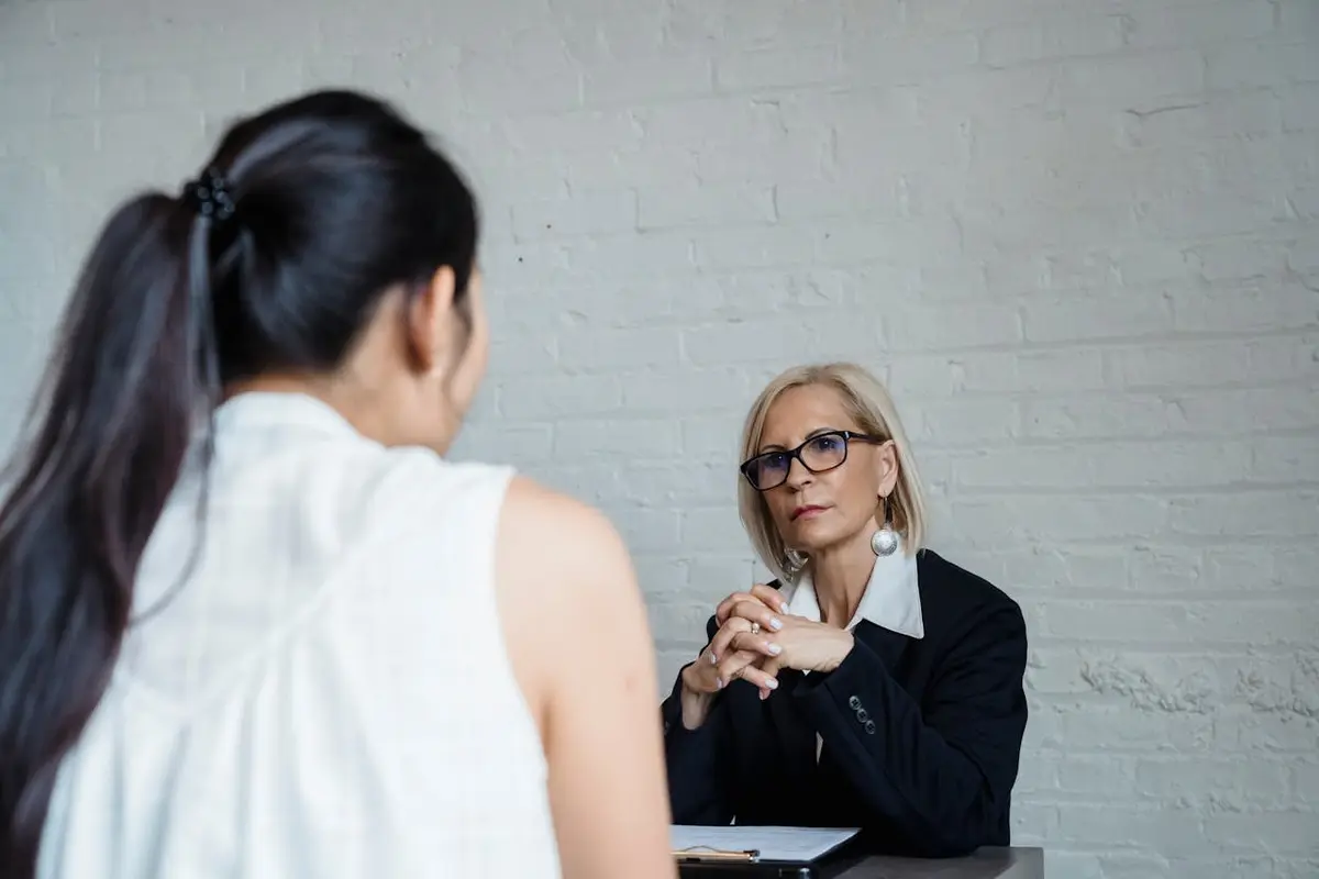 Woman listening intently during a discussion in an office